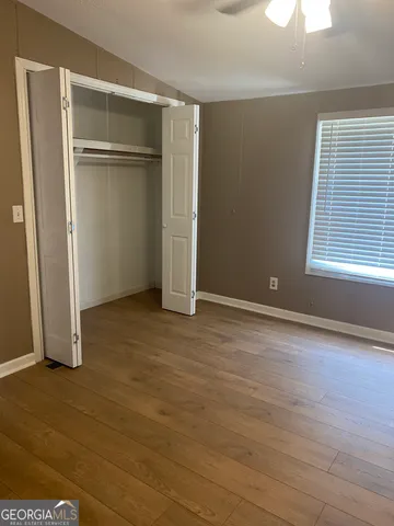 a room with a cabinets and wooden floor