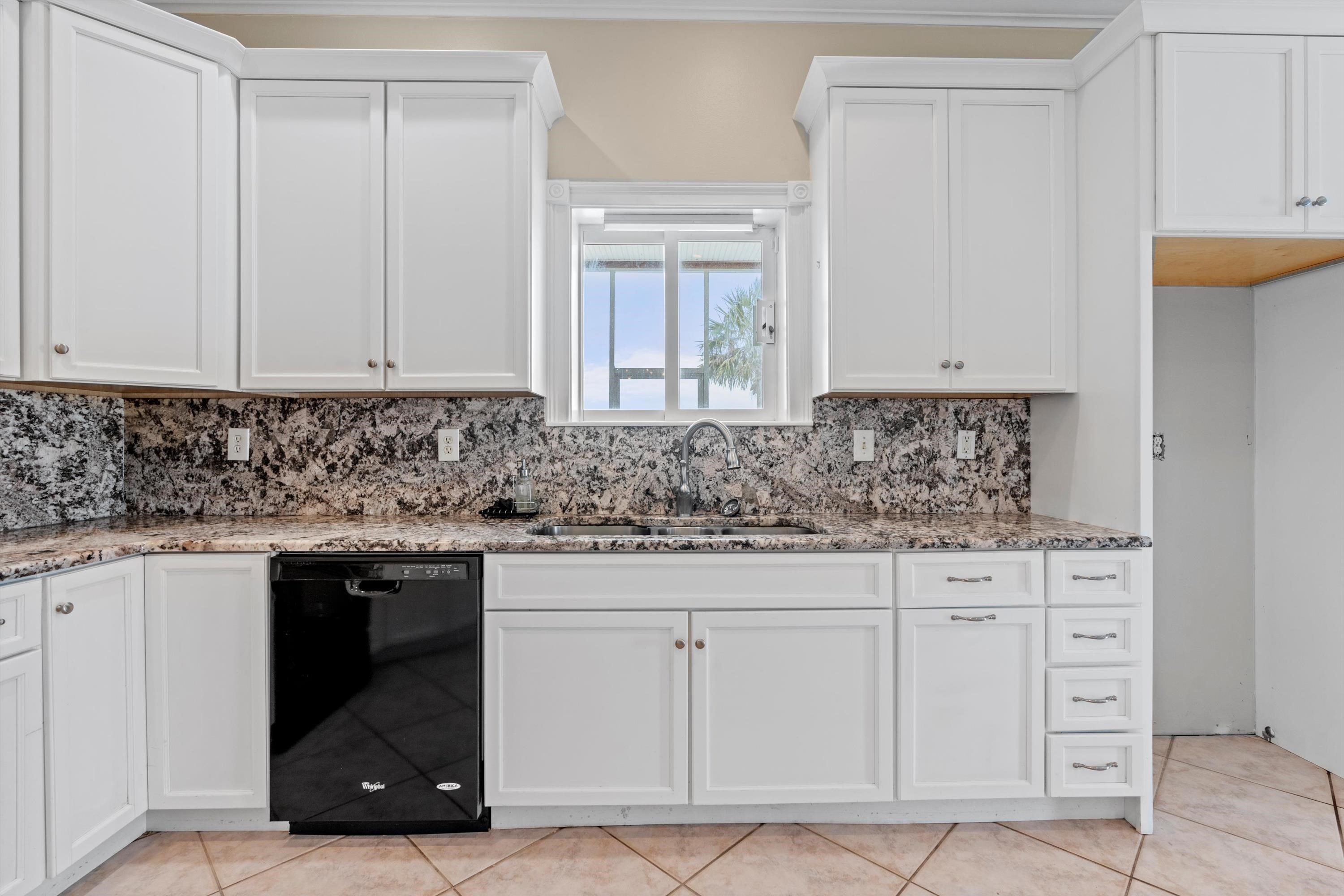 231 Barrataria Drive St. Augustine, FL 32080 - Photo 13 of 43 a kitchen with white cabinets