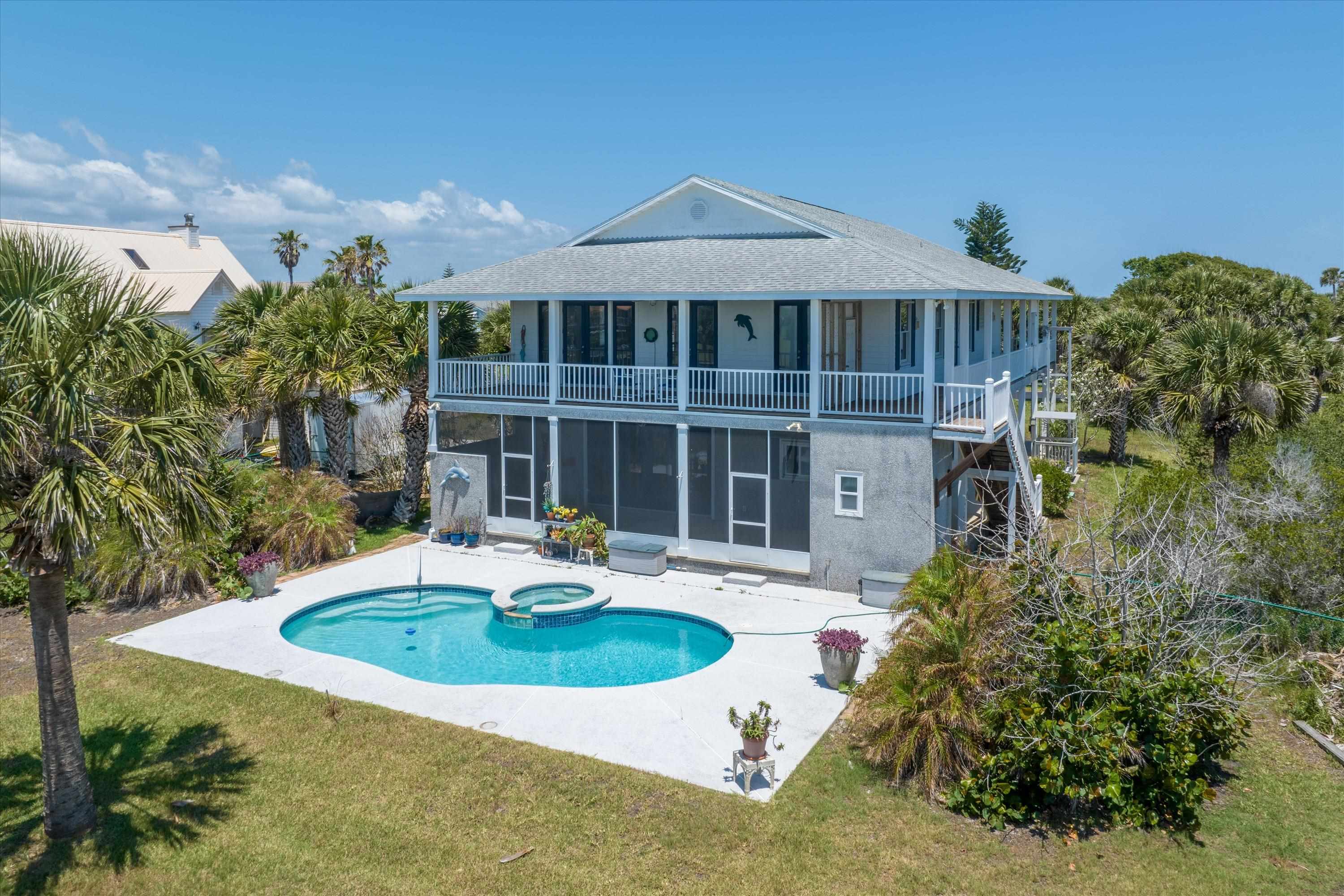 231 Barrataria Drive St. Augustine, FL 32080 - Photo 2 of 43 a front view of a house with a yard