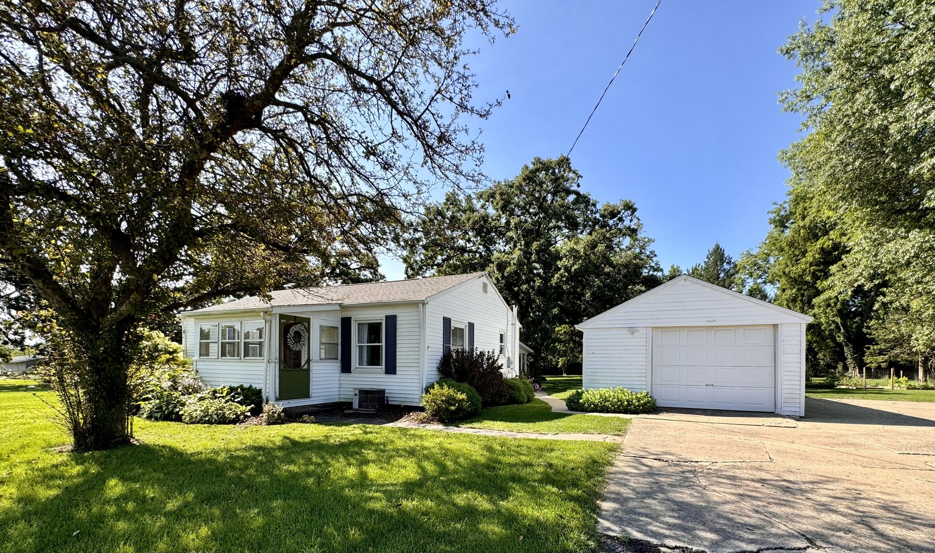 1087 Lost Nation Road Dixon, IL 61021 - Photo 1 of 23 a front view of house with yard and green space
