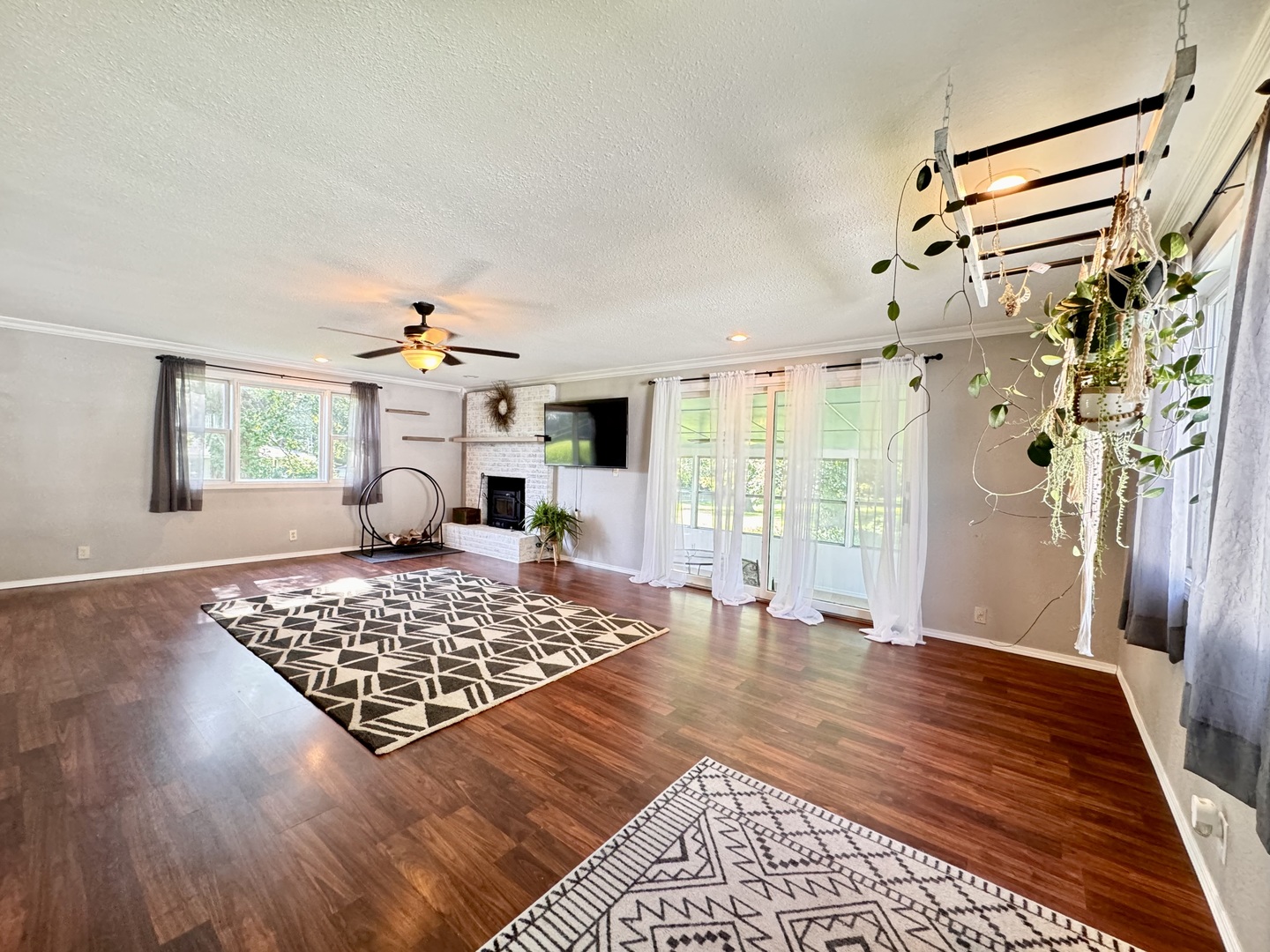 1087 Lost Nation Road Dixon, IL 61021 - Photo 2 of 23 a living room with a couch and a rug