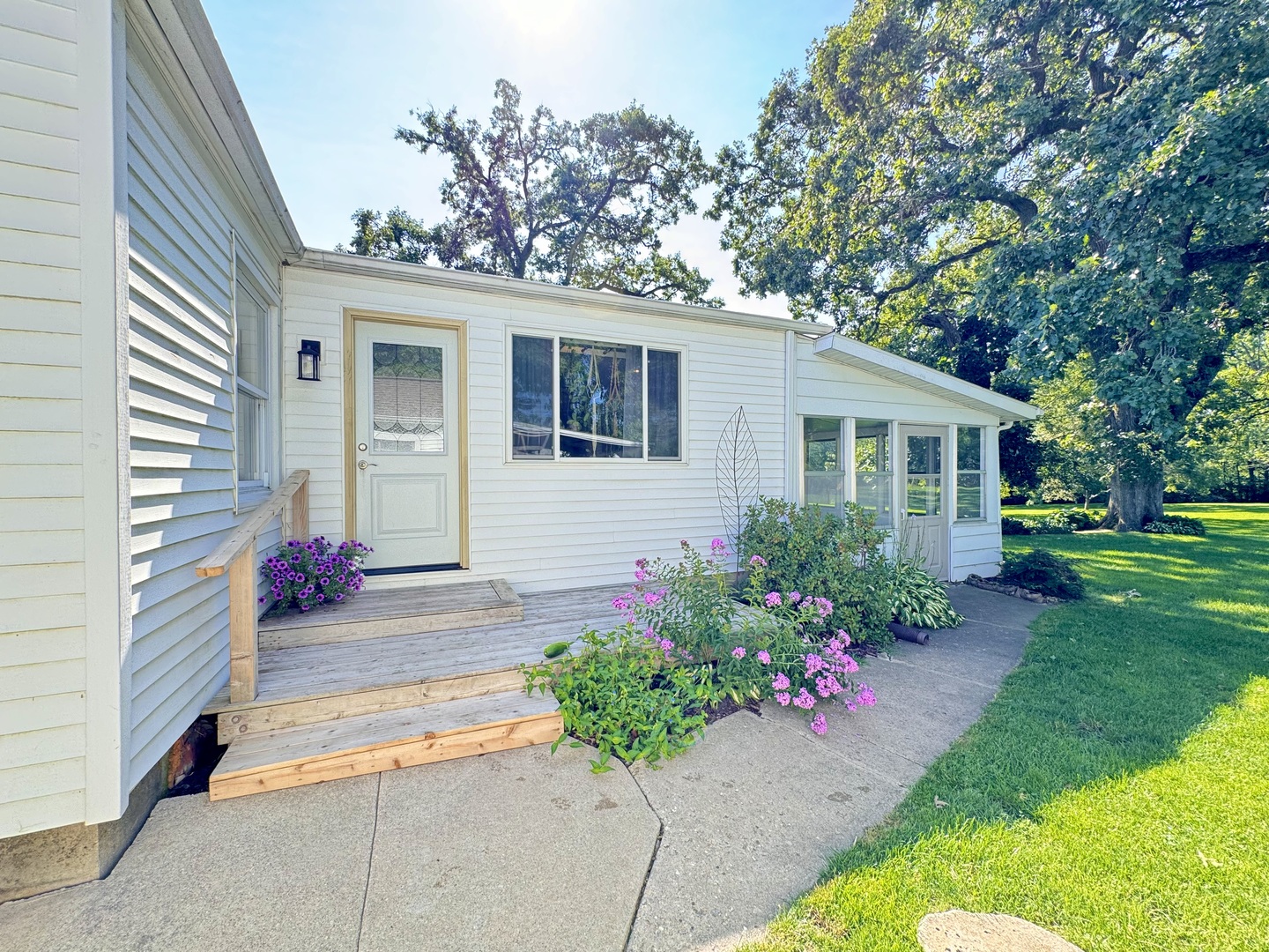 1087 Lost Nation Road Dixon, IL 61021 - Photo 23 of 23 a house view with a seating space and garden