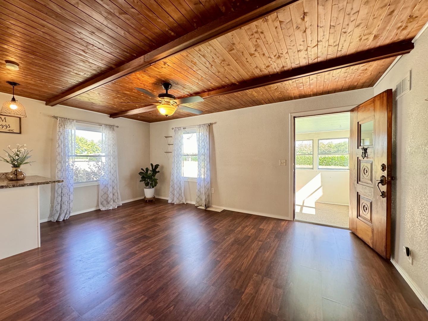 1087 Lost Nation Road Dixon, IL 61021 - Photo 8 of 23 a view of an empty room with wooden floor and a window