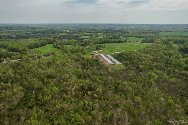 view of a field with trees in background