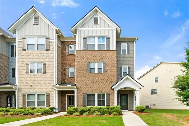 a front view of a house with garden