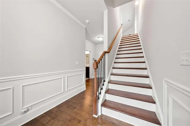 a view of an entryway with wooden floor