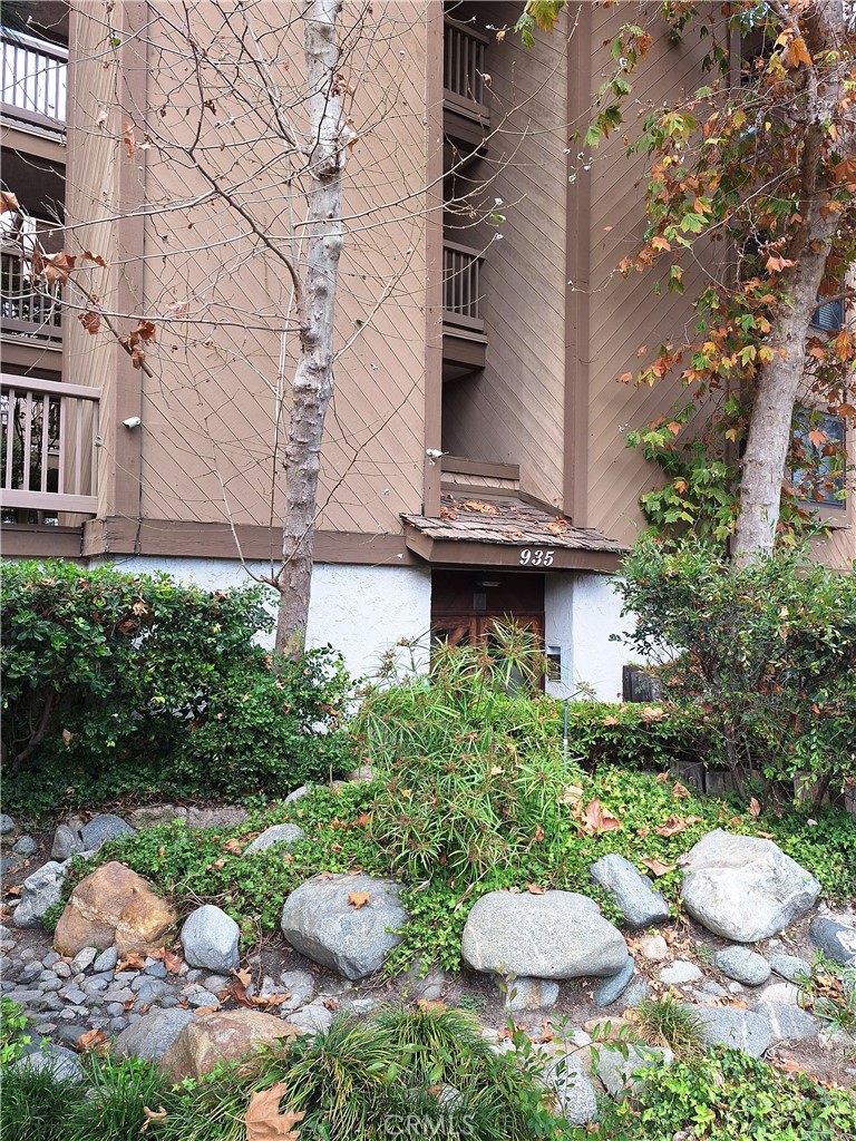 a view of a chair and table in backyard