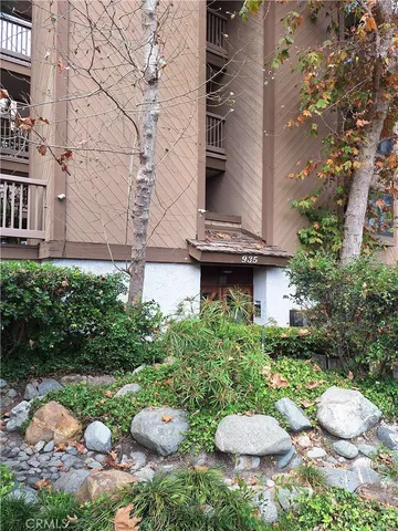 a view of a chair and table in backyard
