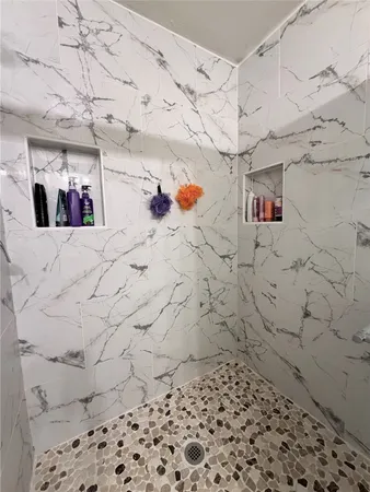 a bathroom with a sink and a shower