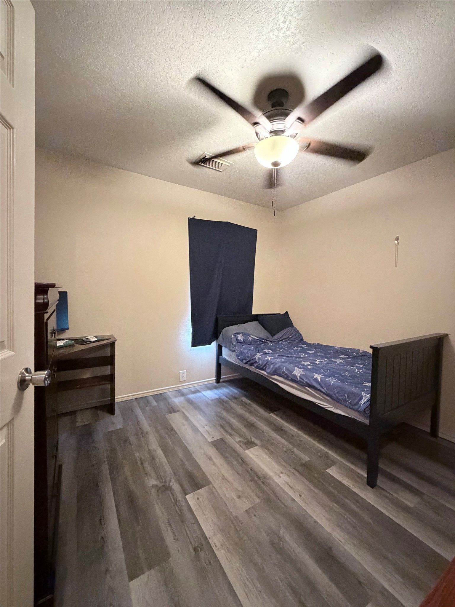 23614 Wildwood Green Way Spring, TX 77373 - Photo 18 of 27 a living room with a bed and a ceiling fan