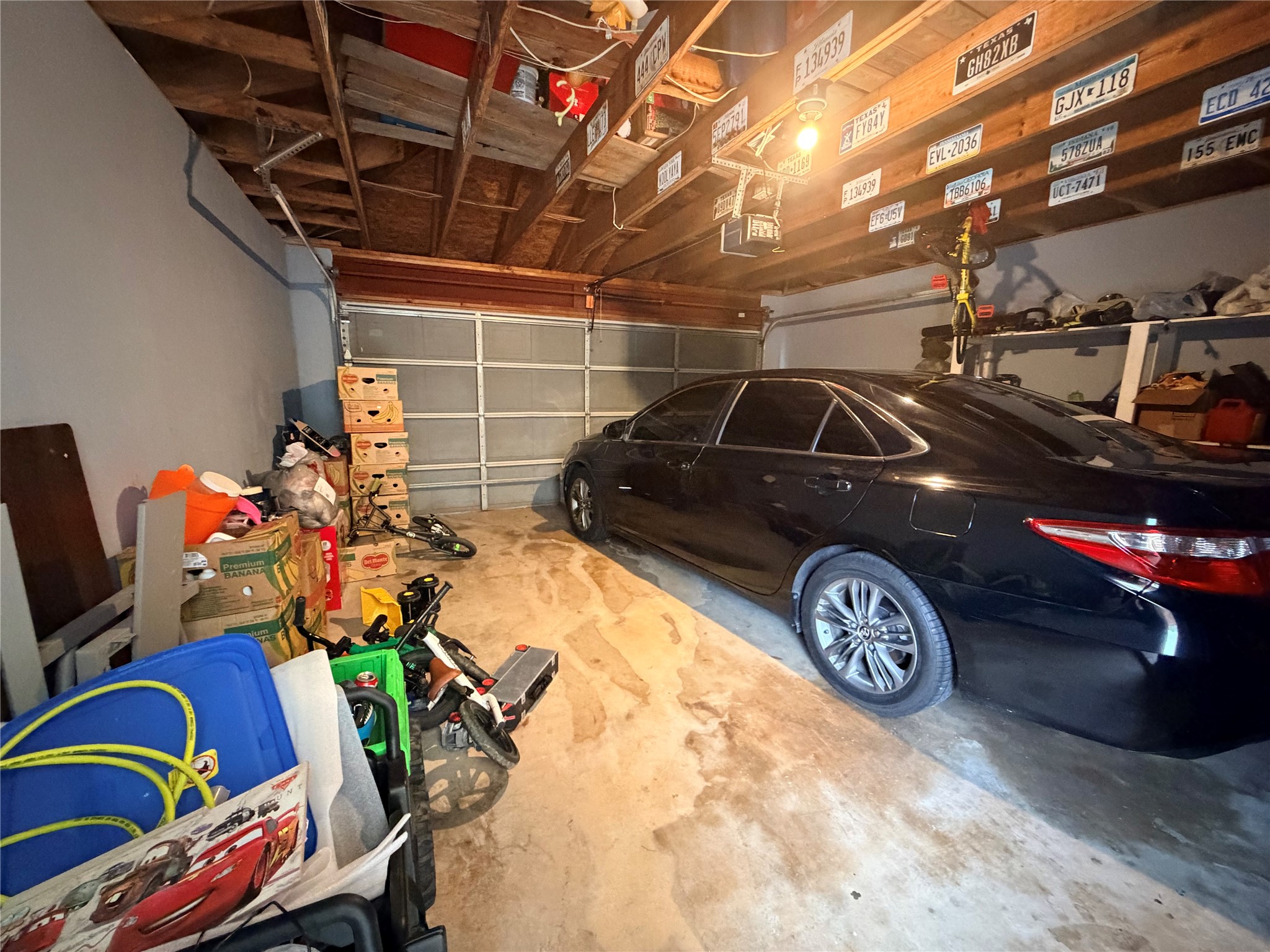 23614 Wildwood Green Way Spring, TX 77373 - Photo 22 of 27 a view of a garage with stuff