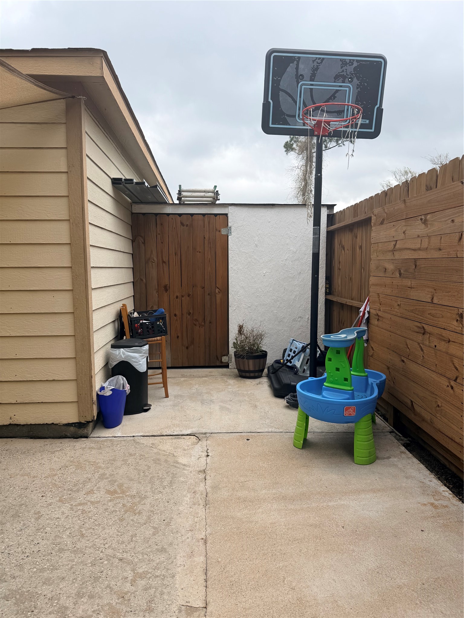 23614 Wildwood Green Way Spring, TX 77373 - Photo 26 of 27 a blue bench sitting in front of a house