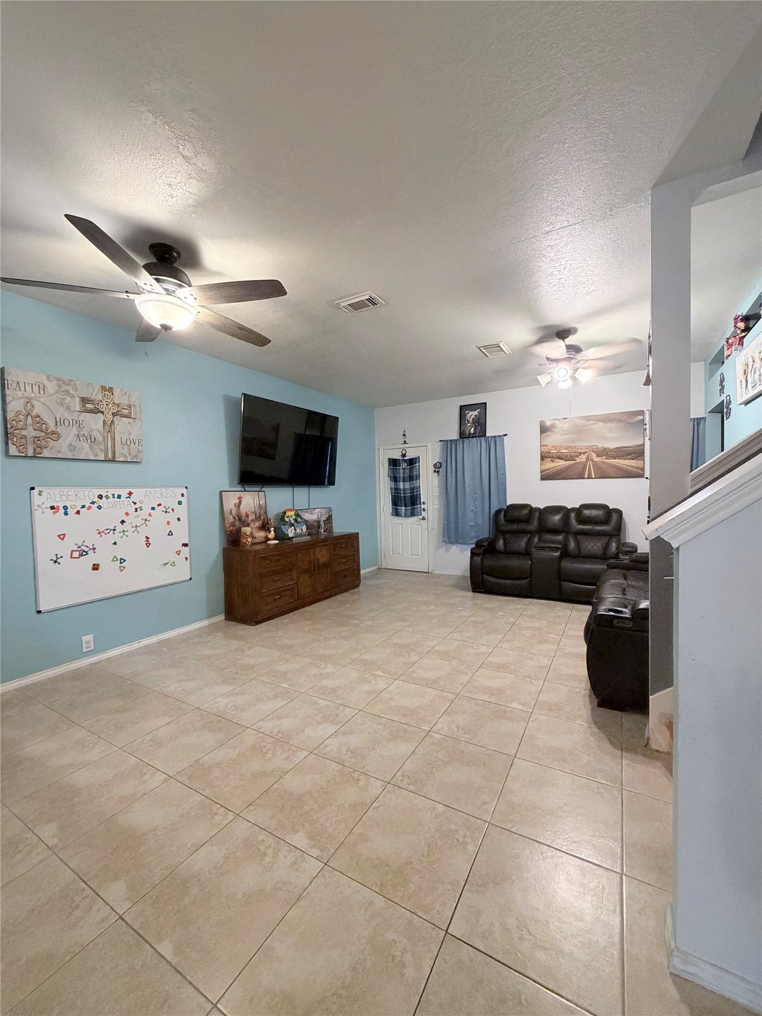 23614 Wildwood Green Way Spring, TX 77373 - Photo 3 of 27 a living room with furniture and a flat screen tv