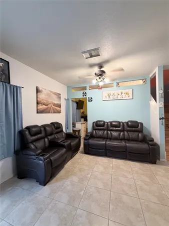 a living room with furniture and a couch