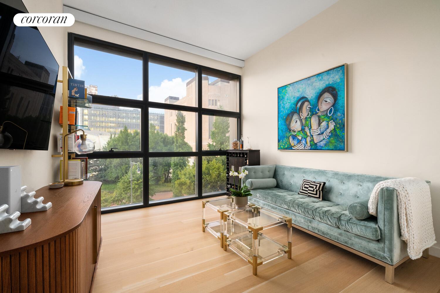 290 West Street, Unit 3A Manhattan, NY 10013 - Photo 13 of 21 a living room with furniture a flat screen tv and a large window