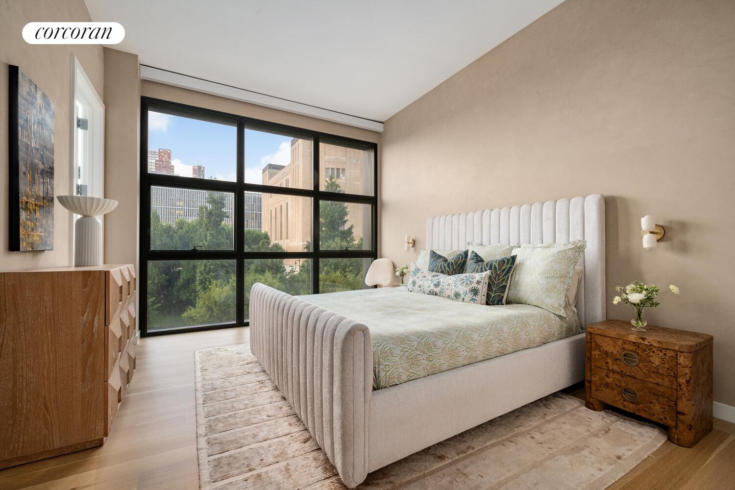 290 West Street, Unit 3A Manhattan, NY 10013 - Photo 7 of 21 a bedroom with a large bed and a large window