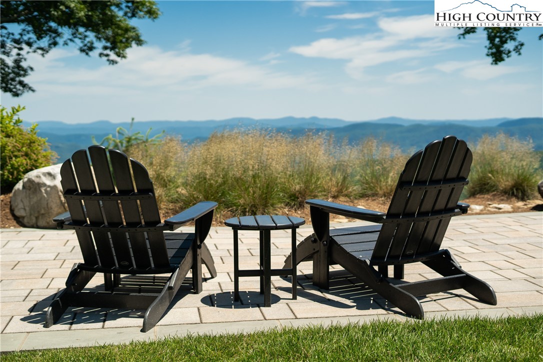 13 August Lily Lane Boone, NC 28607 - Photo 12 of 29 a view of a balcony with chairs and wooden floor