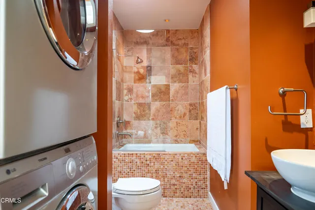 a bathroom with a shower a toilet and a shower