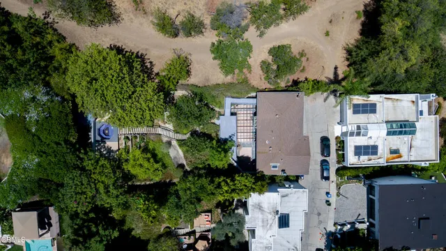 an aerial view of residential houses with outdoor space