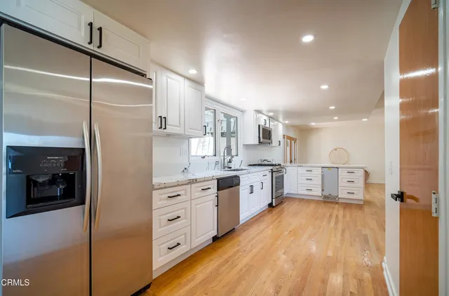a large kitchen with cabinets