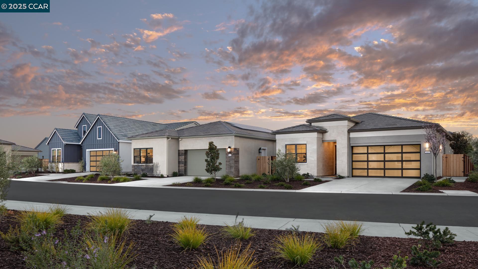 1634 Granite Place Tracy, CA 95377 - Photo 26 of 28 a front view of a house with a yard