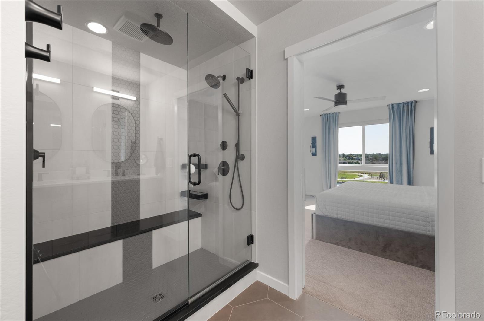 3563 Mission Bay Court Colorado Springs, CO 80922 - Photo 13 of 48 a bathroom with a shower and a tub