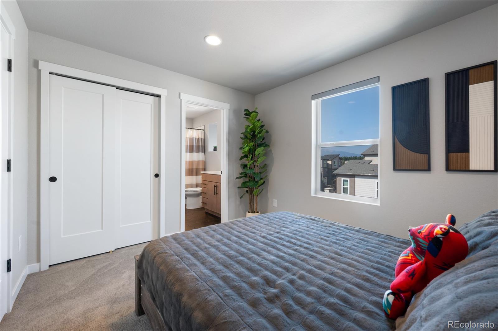 3563 Mission Bay Court Colorado Springs, CO 80922 - Photo 14 of 48 a bedroom with a bed and a window