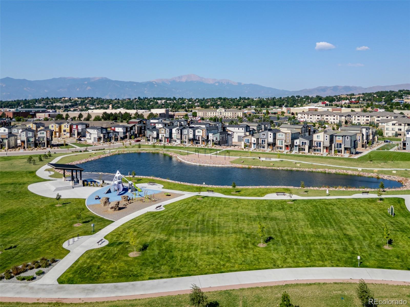 3563 Mission Bay Court Colorado Springs, CO 80922 - Photo 24 of 48 a view of a swimming pool with an ocean view
