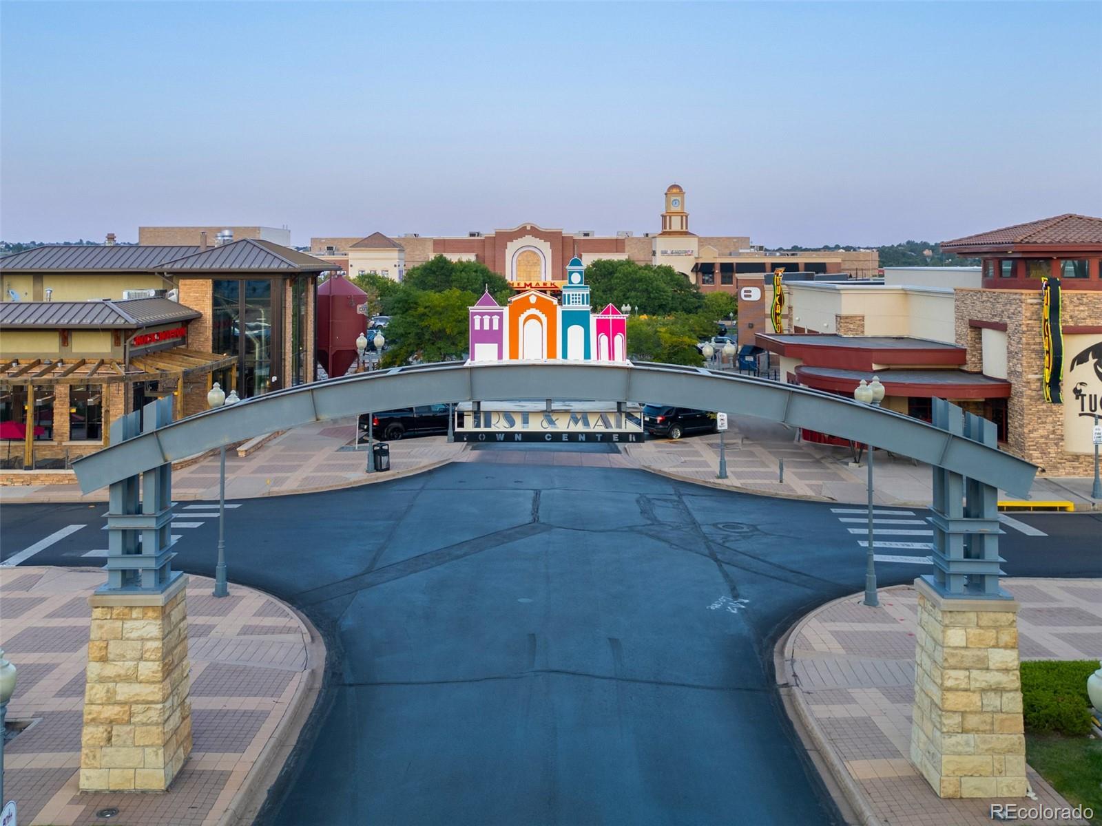 3563 Mission Bay Court Colorado Springs, CO 80922 - Photo 25 of 48 a living room with furniture and a fireplace