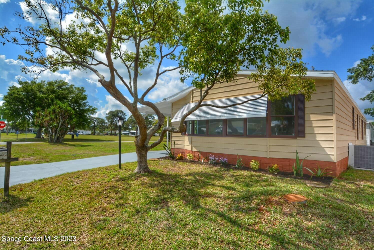 313 Kiwi Drive Sebastian, FL 32976 - Photo 1 of 31 a view of a house with pool and a yard