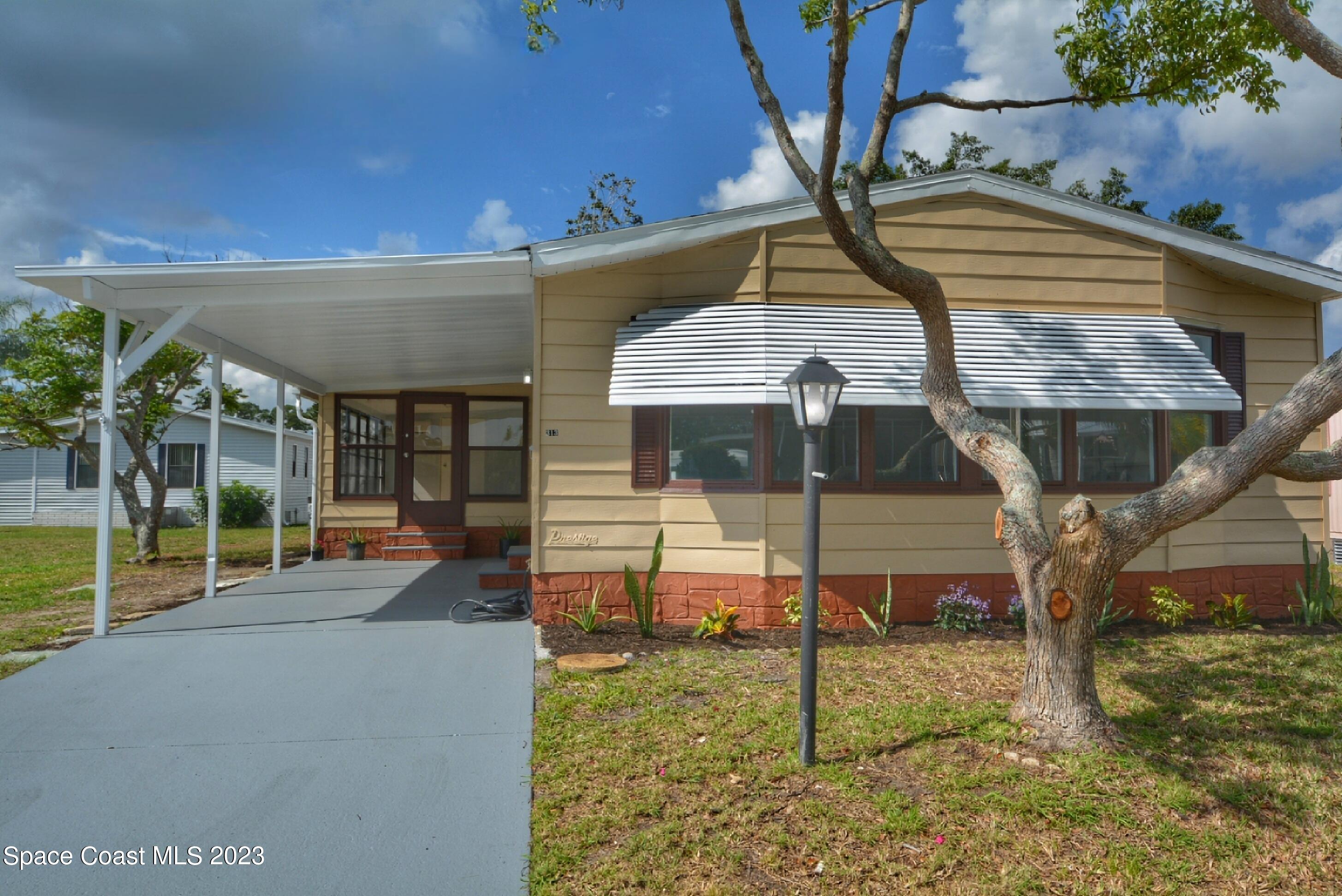 313 Kiwi Drive Sebastian, FL 32976 - Photo 2 of 31 a view of a house with a backyard