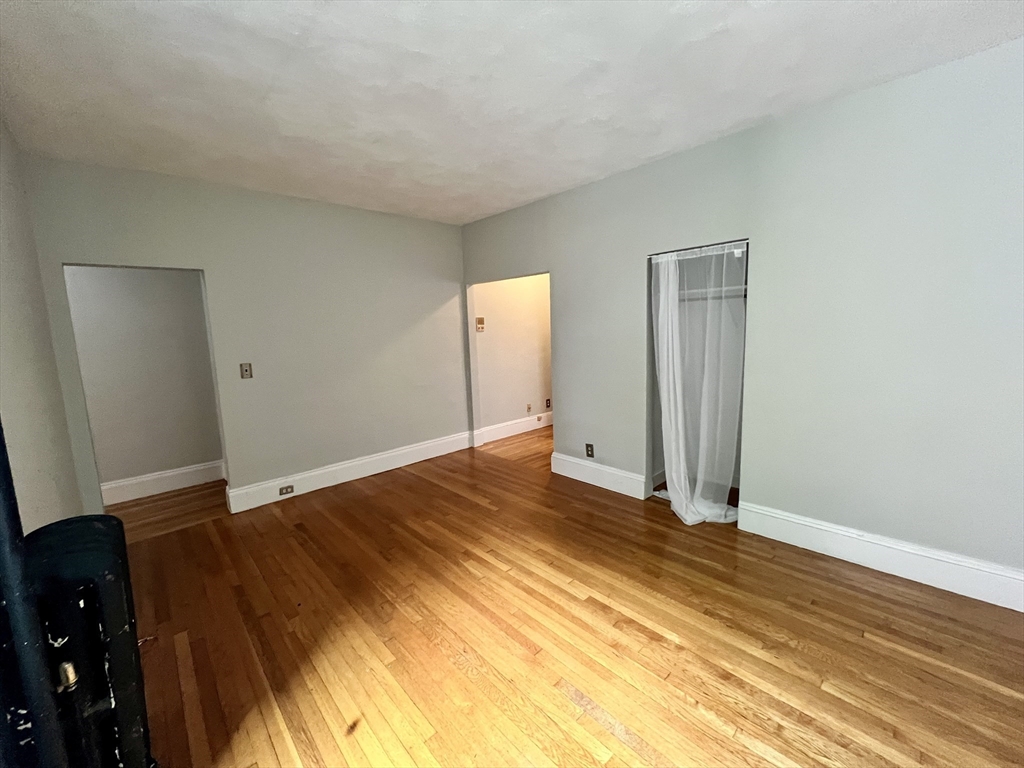 138 Fuller Street, Unit 3 Brookline, MA 02446 - Photo 12 of 27 a view of a livingroom with wooden floor