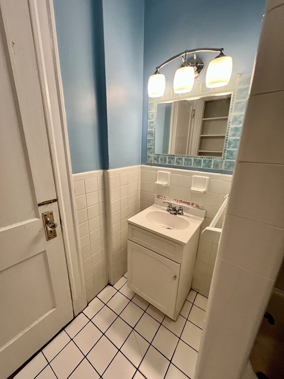 138 Fuller Street, Unit 3 Brookline, MA 02446 - Photo 13 of 27 a utility room with dryer and washer