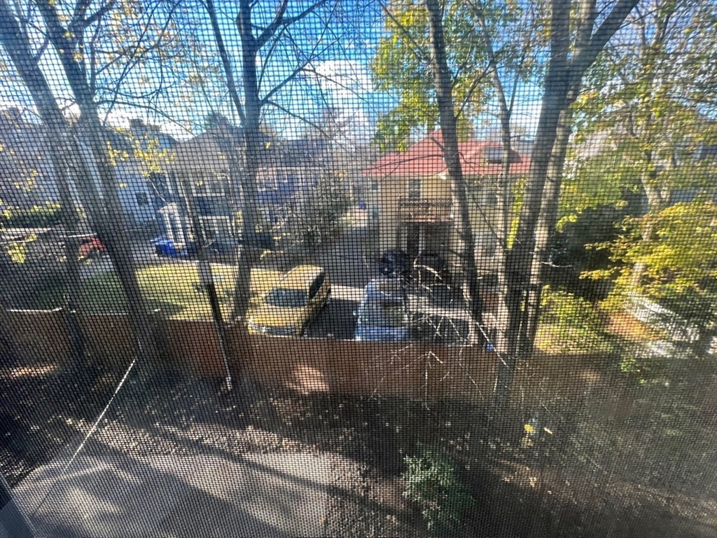 138 Fuller Street, Unit 3 Brookline, MA 02446 - Photo 25 of 27 a view of a backyard with sitting area