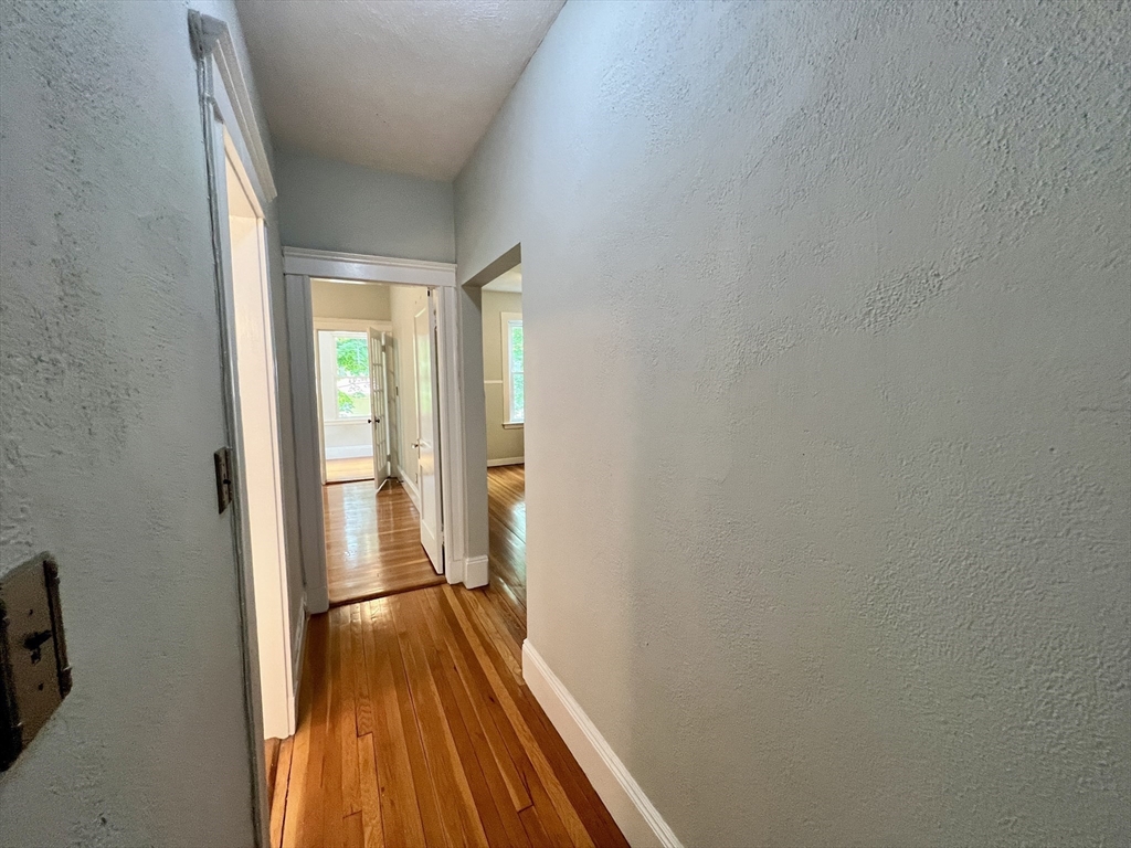 138 Fuller Street, Unit 3 Brookline, MA 02446 - Photo 8 of 27 a view of balcony with wooden floor