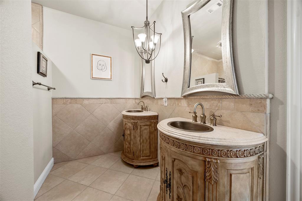 219 Mohundro Road Ferris, TX 75125 - Photo 30 of 40 a bathroom with a sink and a mirror
