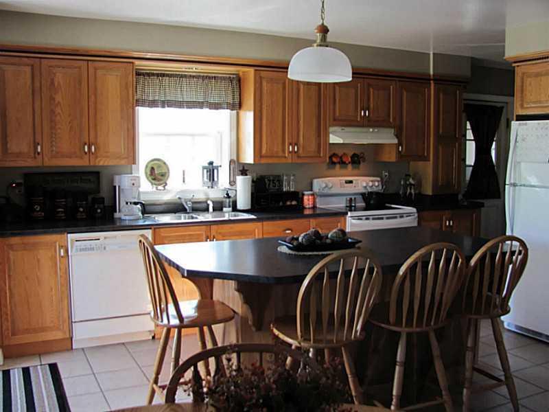 596 New Canada Road New Canada, ME 04743 - Photo 26 of 35 Kitchen. Custom cabinetry granite...