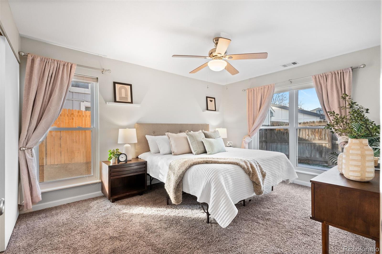 16373 East Rice Place, Unit B Aurora, CO 80015 - Photo 18 of 26 a spacious bedroom with a bed and a window