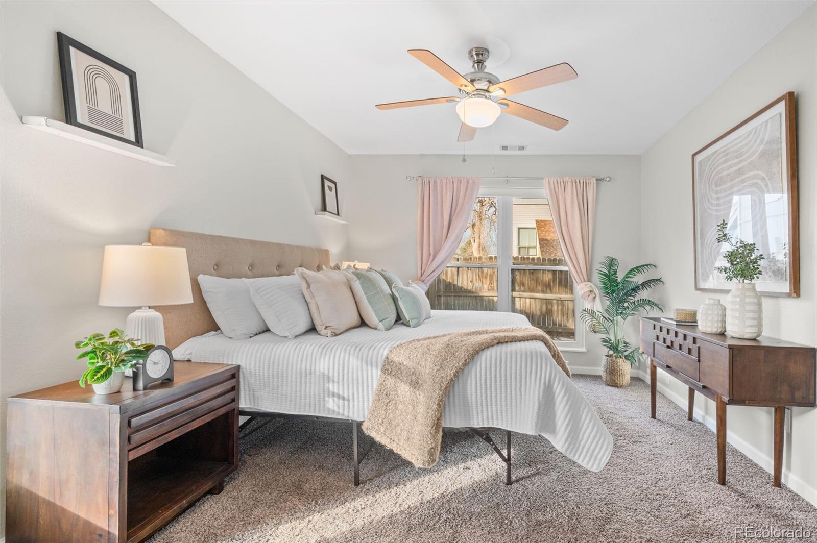16373 East Rice Place, Unit B Aurora, CO 80015 - Photo 19 of 26 a bed room with furniture and a large window