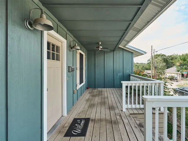 a view of a balcony with wooden floor