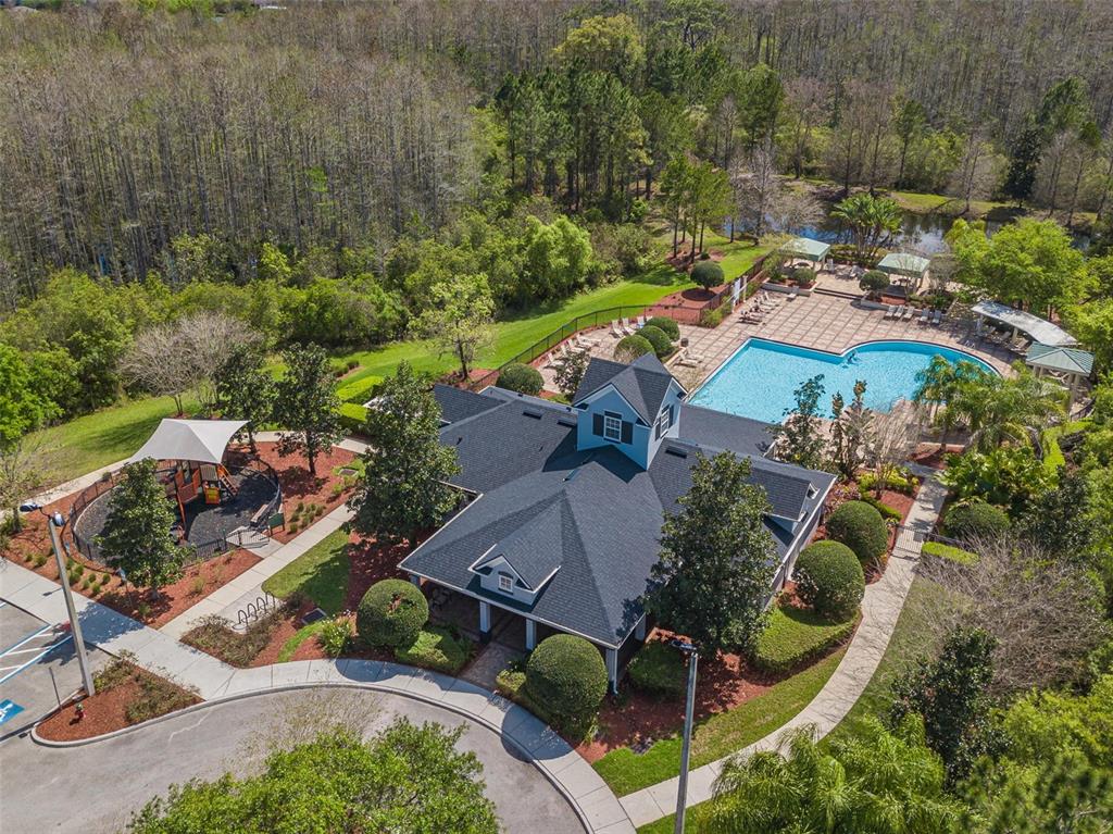 an aerial view of a house with outdoor space