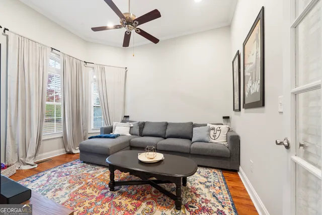 a living room with furniture and a rug
