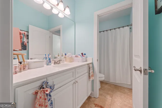 a bathroom with a double vanity sink mirror and double