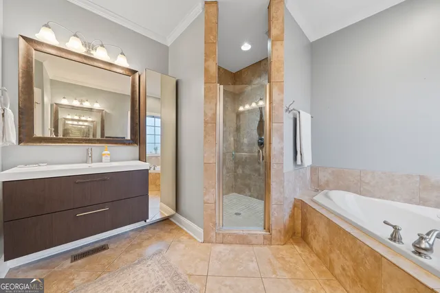 a bathroom with a tub sink and mirror