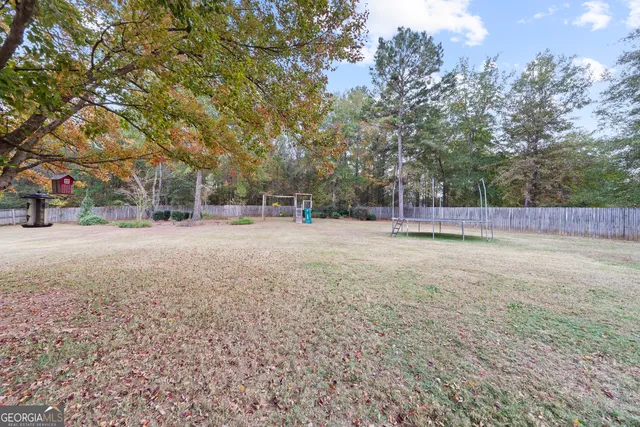 a view of outdoor space with deck and trees