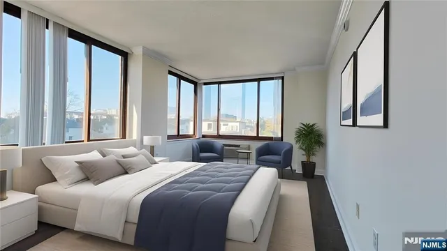 a bedroom with bed and a large window