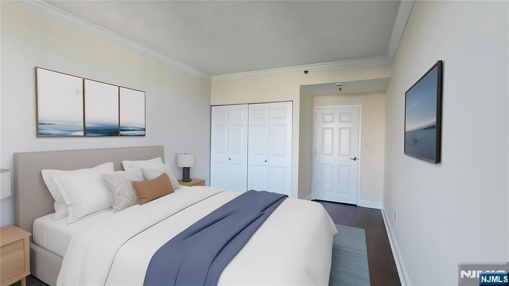 100 Old Palisade Road, Unit 1711 Fort Lee, NJ 07024 - Photo 22 of 26 a bedroom with a bed and a mirror