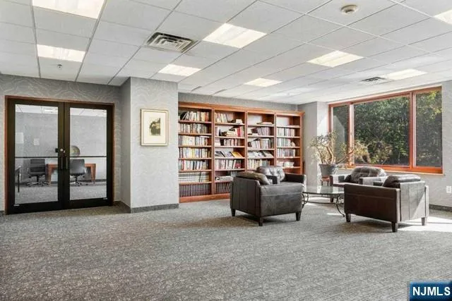 a view of living room with furniture and floor to ceiling window