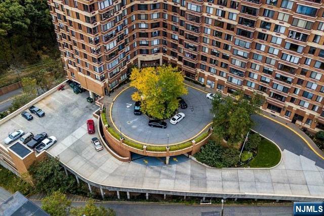 100 Old Palisade Road, Unit 1711 Fort Lee, NJ 07024 - Photo 3 of 26 a view of a swimming pool with a yard