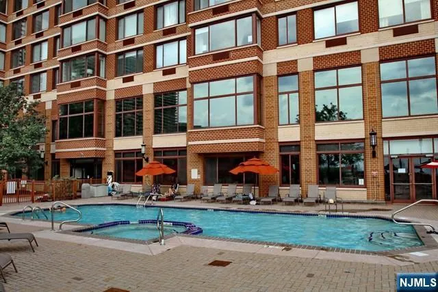 a front view of building with small garden